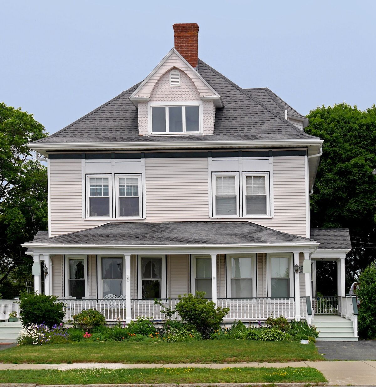 white wooden house with large roofed porch