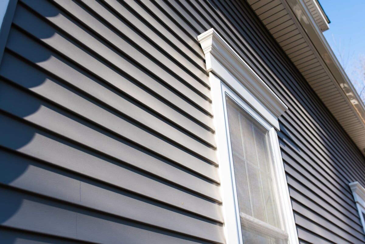 Dark vinyl siding on house