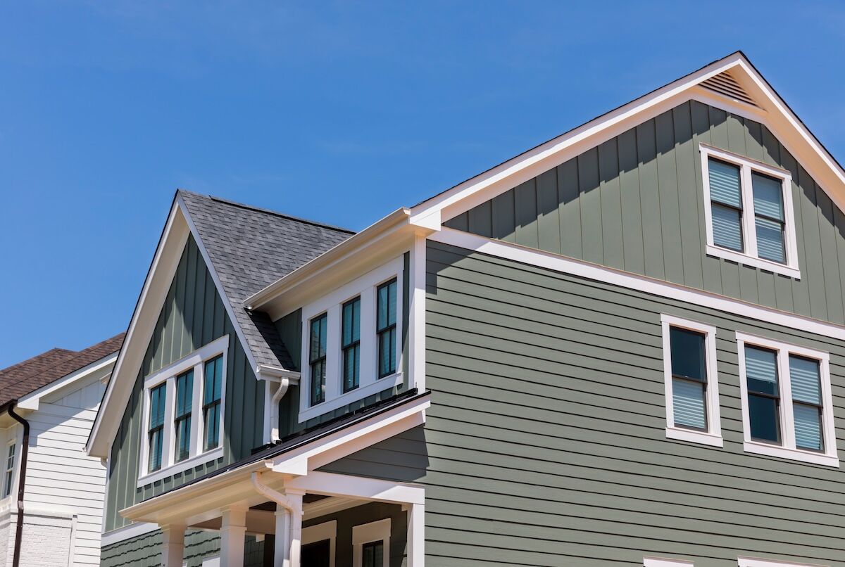 Classic vinyl siding on family home, color green