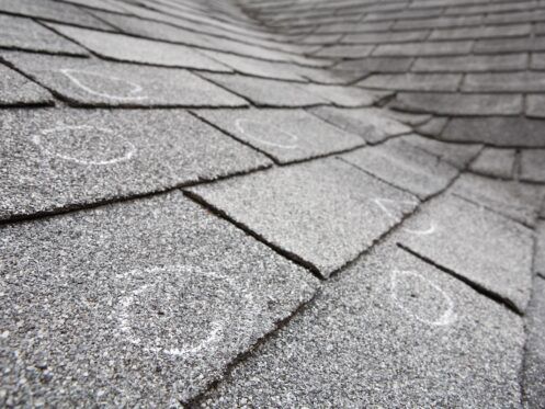 old roof with hail damage