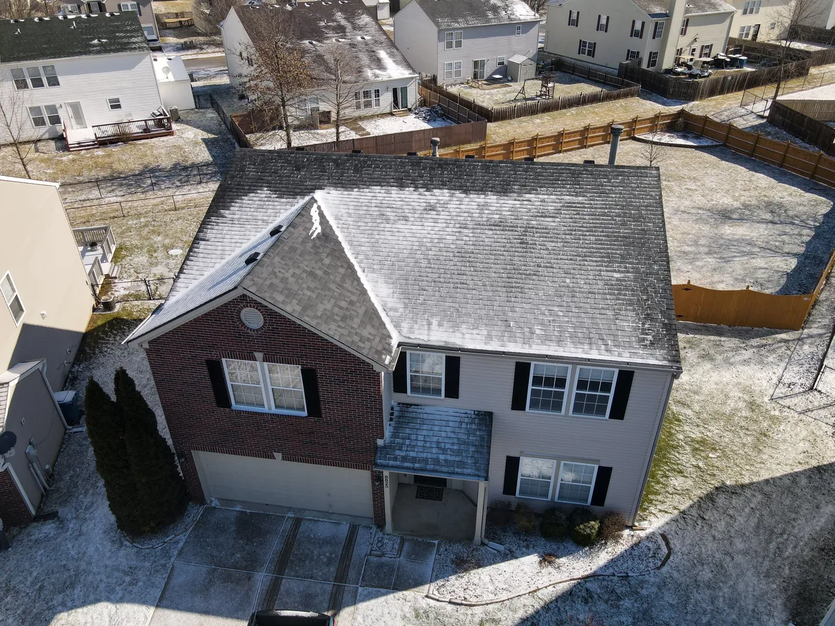 snow on roof house