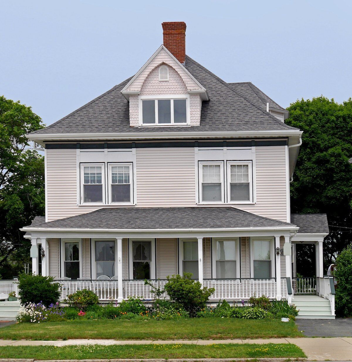white wooden house with large roofed porch