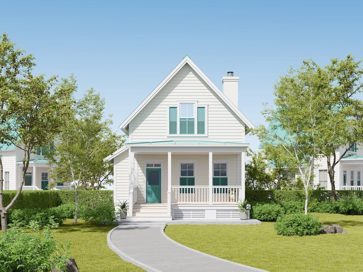 White plain house with sage green accents
