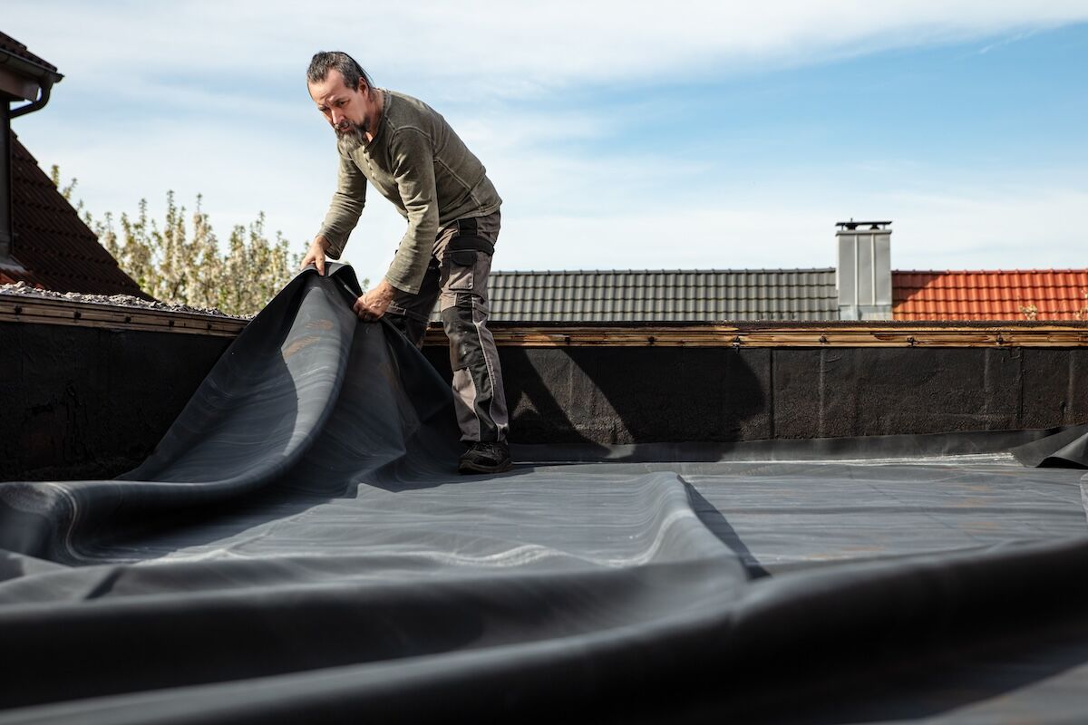 roofer repairing rubber roof