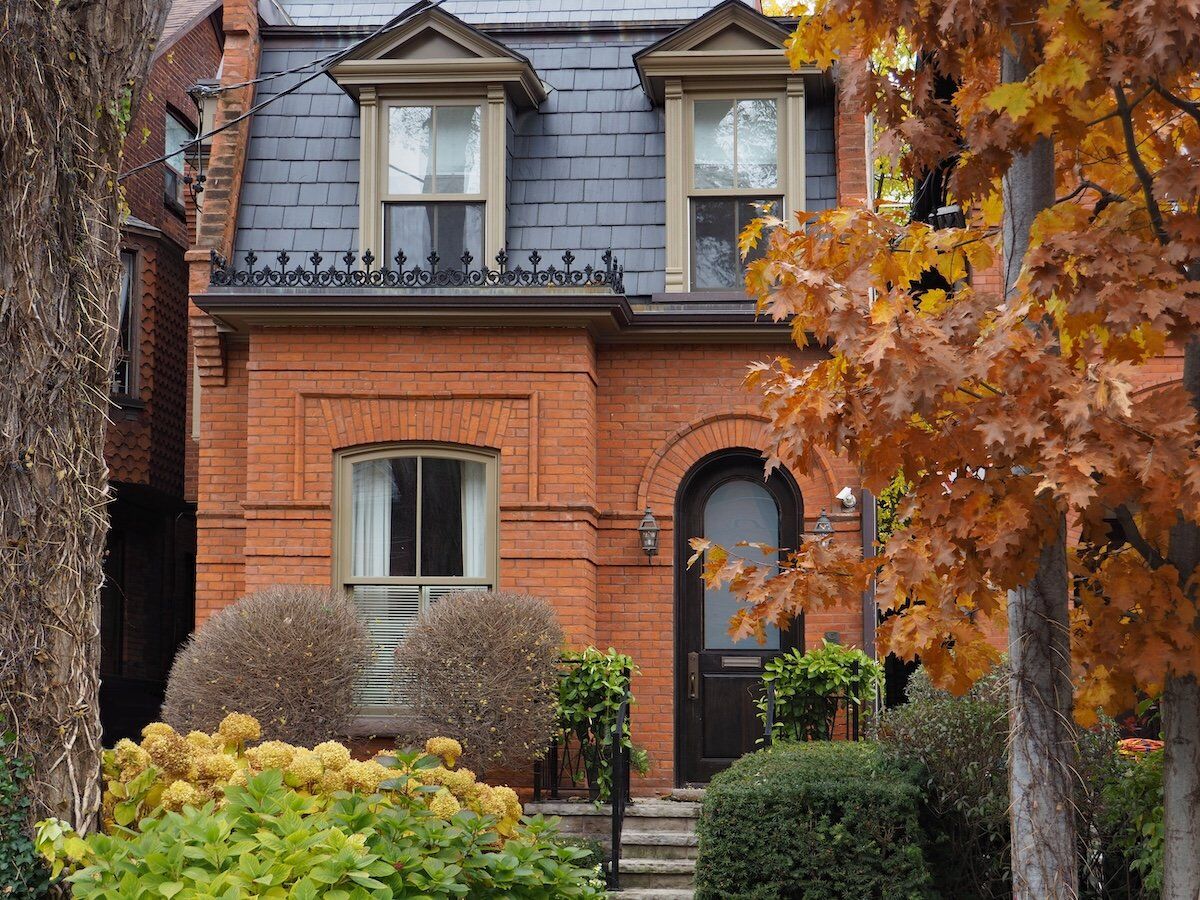Classic brick house with mansard roofing