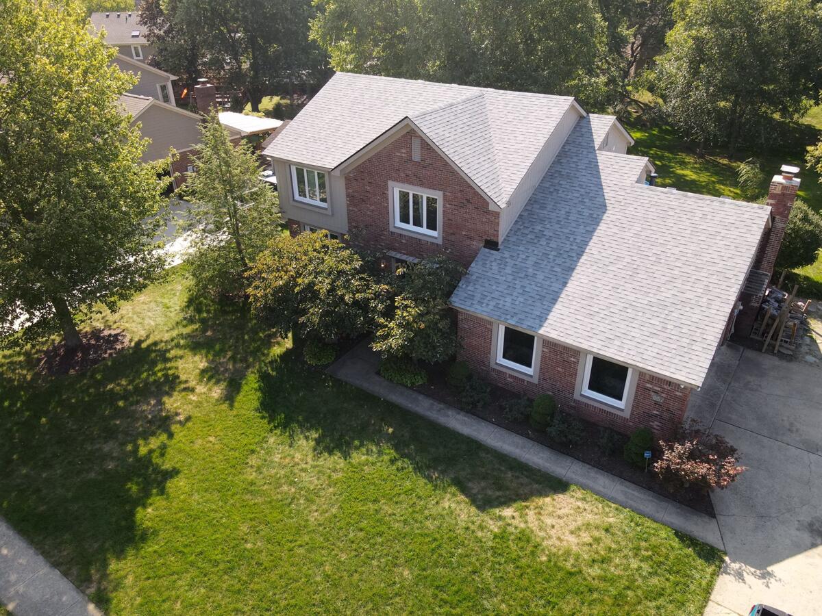 brick house with shingles