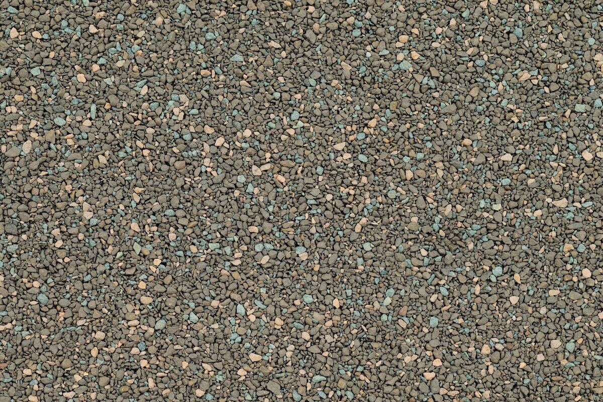 Close up detail shot of tar and gravel roof