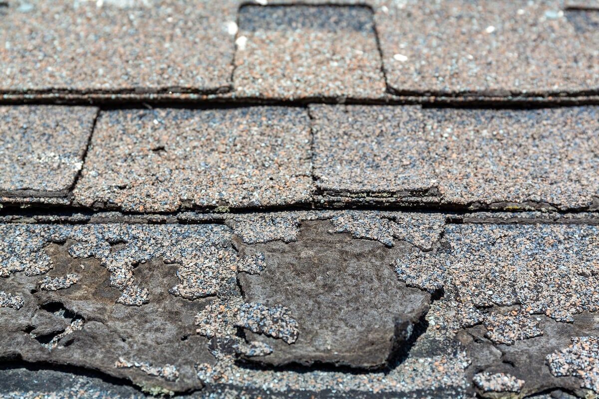 Close view of sun damaged shingles.