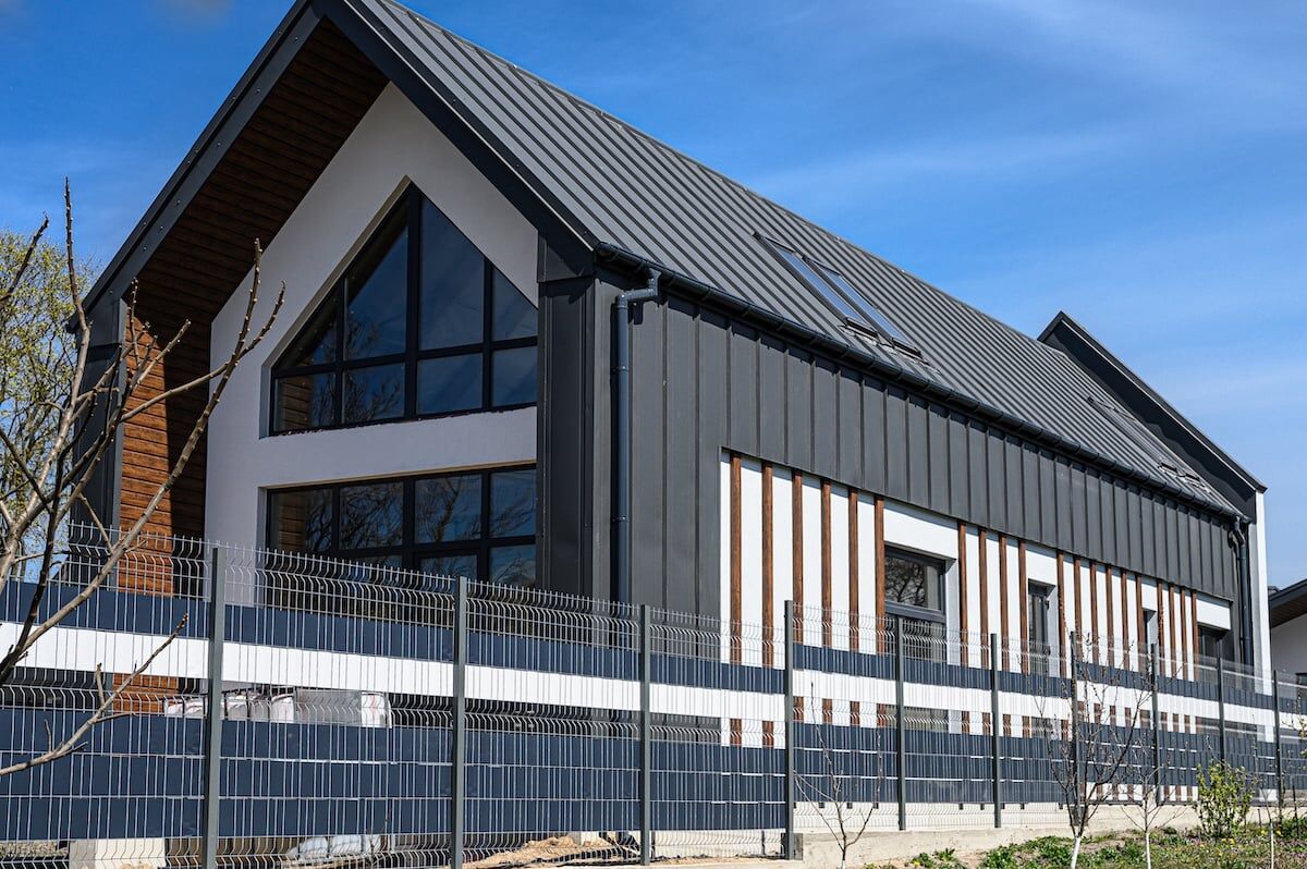 Gray house with metal tile.