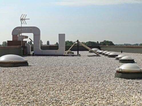 Flat Roof With Gravel and Skylight Windows