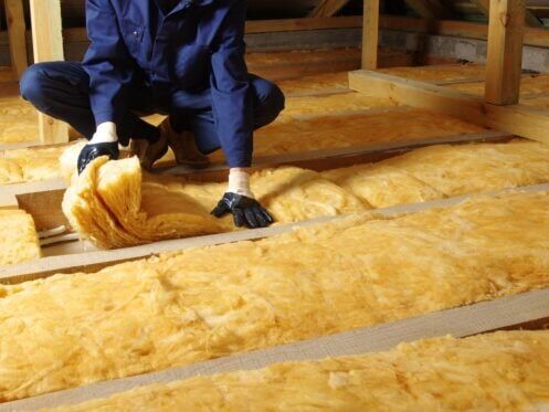 person installing insulation