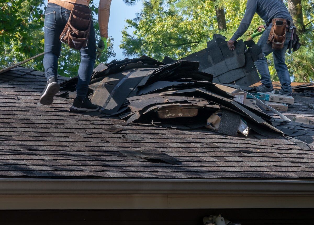 Removing damaged roofing material after a storm