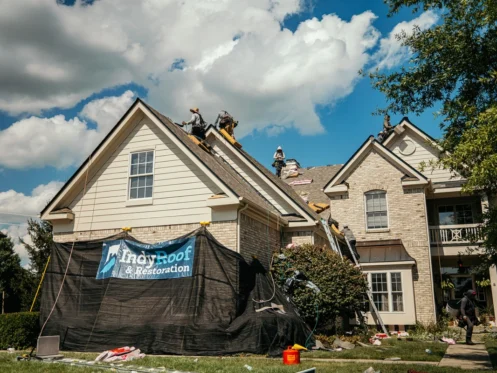 indy roof and restoration workers mid way through a roof replacement
