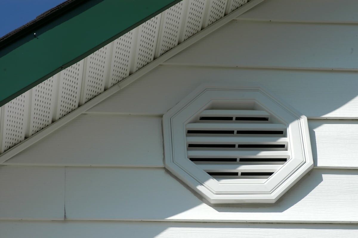 White vinyl siding with white soffit vents