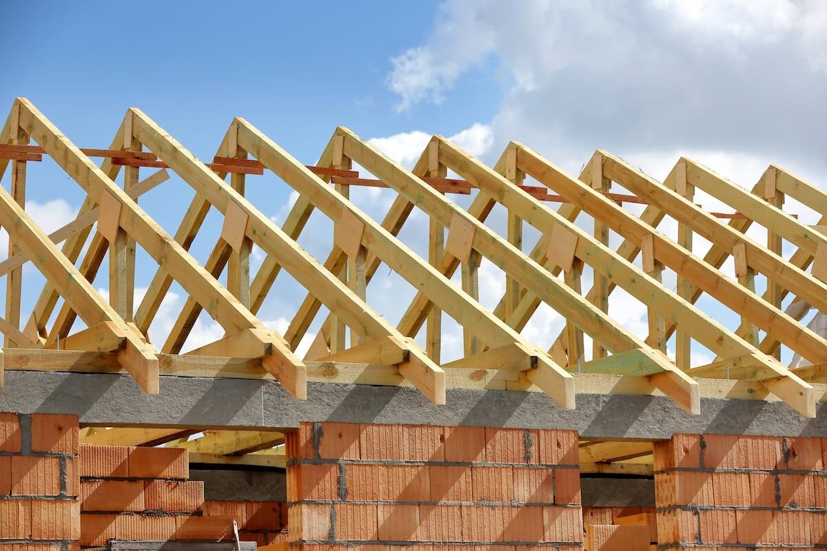 Wooden frame truss system of the roof building.